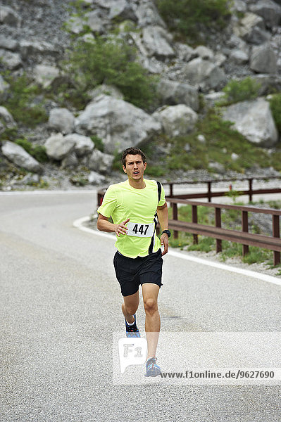 Italy  Trentino  man running in a competition near Lake Garda