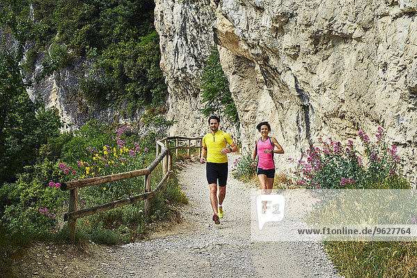 Italy  Trentino  couple jogging at Lake Garda