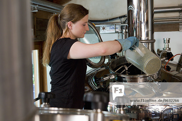 Female brewer working in brewhouse