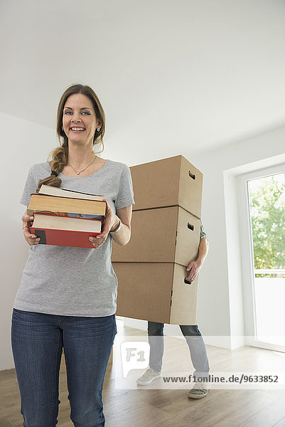 Woman happy smiling moving in new home