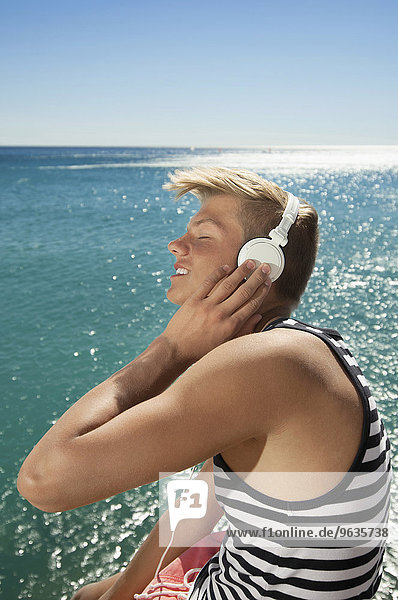 Ocean sunshine portrait teenager headphones music