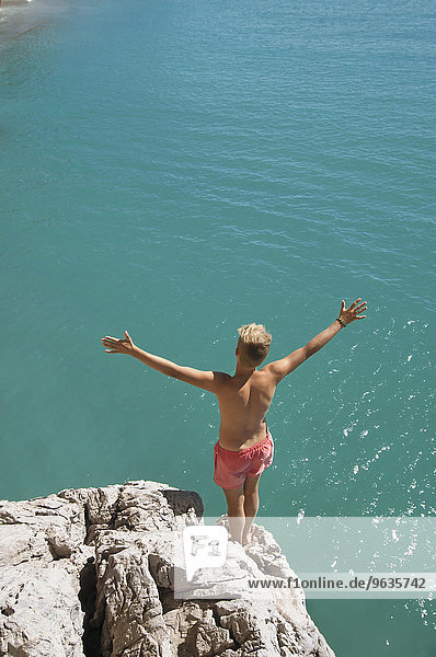 Boy cliff diving holiday ocean sunshine summer