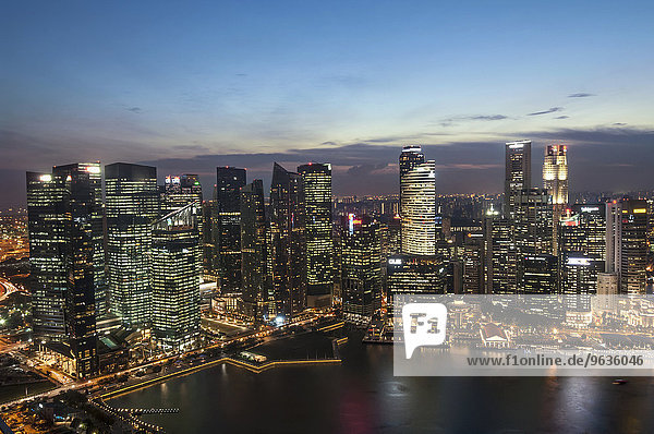Skyscrapers lit up at night in a city