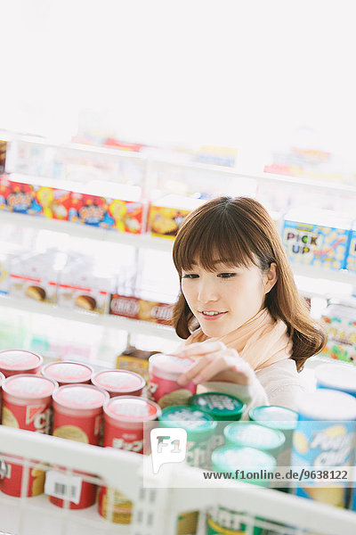 Young Japanese woman in a convenience store