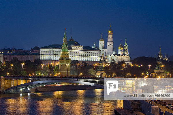 Moscow Kremlin with cathedrals and palace and Bolshoy Kamenny Bridge on Moskva River at night  Moscow  Russia  Europe