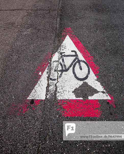 Cycle path marking on a pavement  worn away
