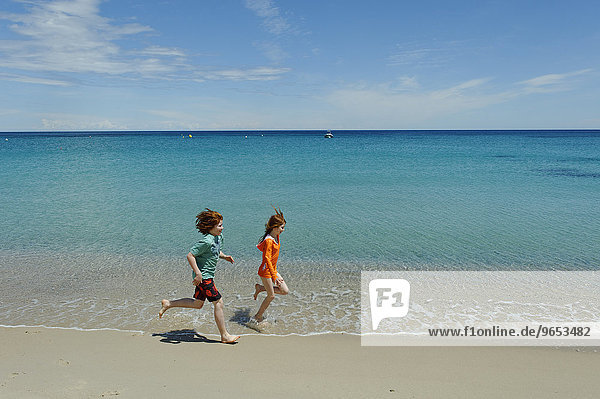 Children running on the beach  Favone  east coast  Corsica  France  Europe