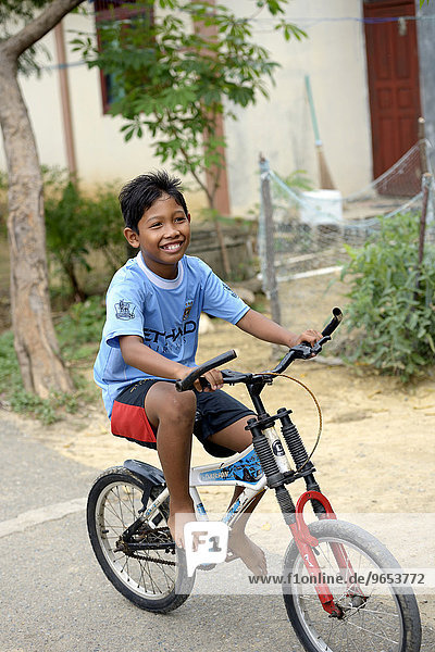 Boy on a bicycle  Banda Aceh  Indonesia  Asia
