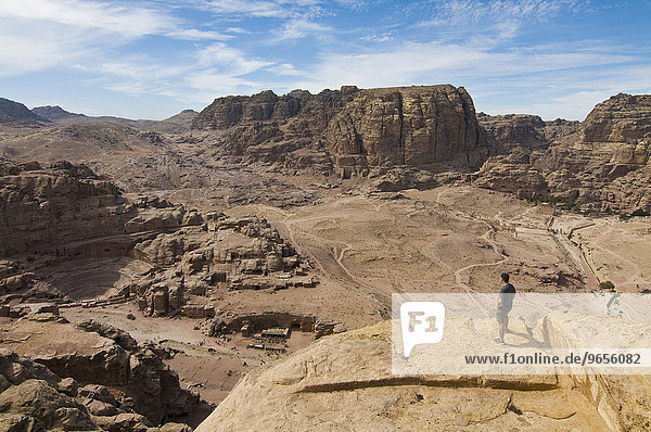 Man overlooking the ruins of the town of Petra  Jordan  Western Asia  Asia