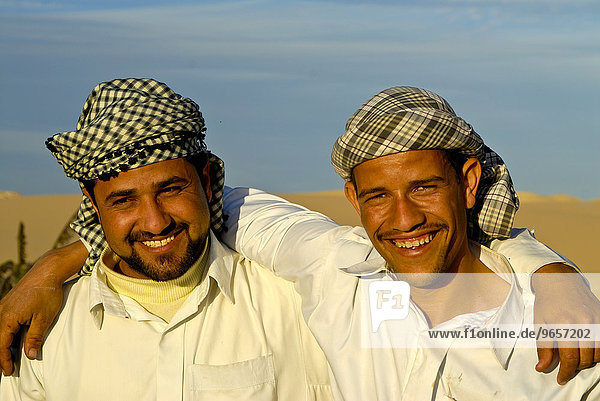 Two Bedouin friends in the desert  Siwa  Egypt  Africa