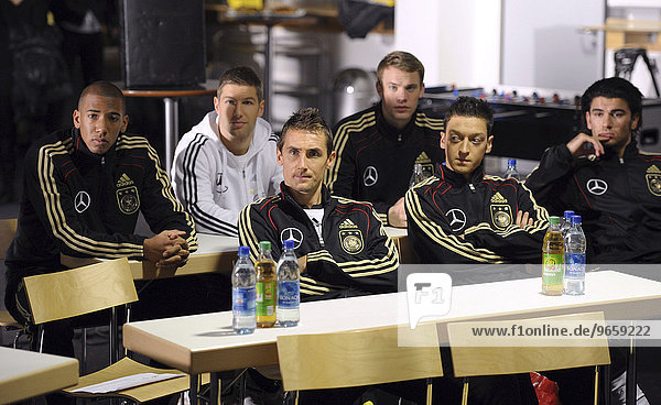 Following the instructions of the director attentively: back  from left: Jerome BOATENG  Thomas Hitzlsperger  Manuel NEUER  front  from left: Miroslav KLOSE  Mesut OEZIL and Serdar Tasci  German national football team shooting a promotional ad for the DFB German Football League general sponsor Mercedes-Benz for the 2010 World Cup in South Africa in the Mercedes-Benz Arena stadium  Stuttgart  Baden-Wuerttemberg  Germany  Europe