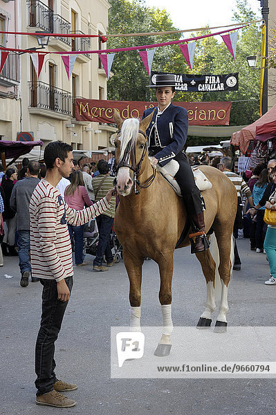 Female rider on Andalusian horse at the annual All Saints Market in Cocentaina  Alicante province  Spain  Europe
