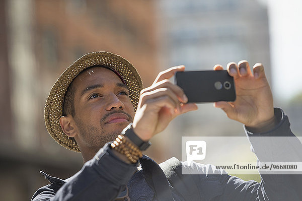 Man taking photo on street