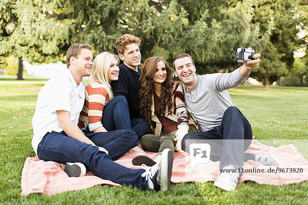 Friends taking selfie in park