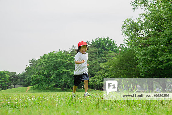 Japanese kid playing in a park