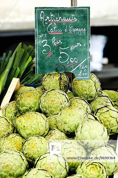 Artichokes with a price label at a market in France