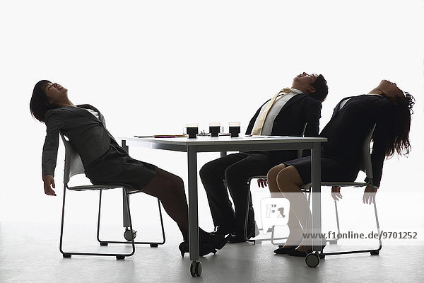 Japanese business people tired after a meeting