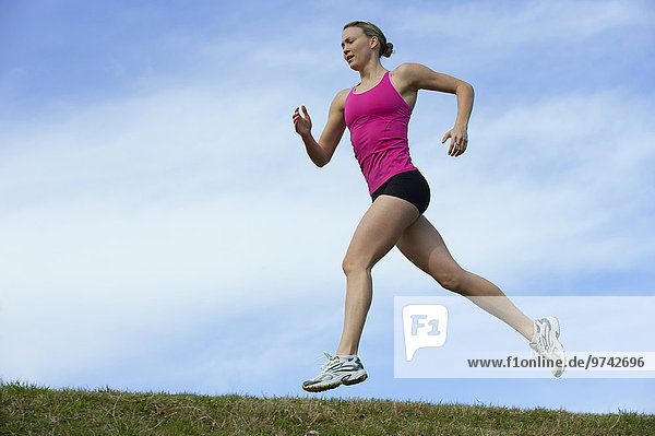 Serious Caucasian woman running