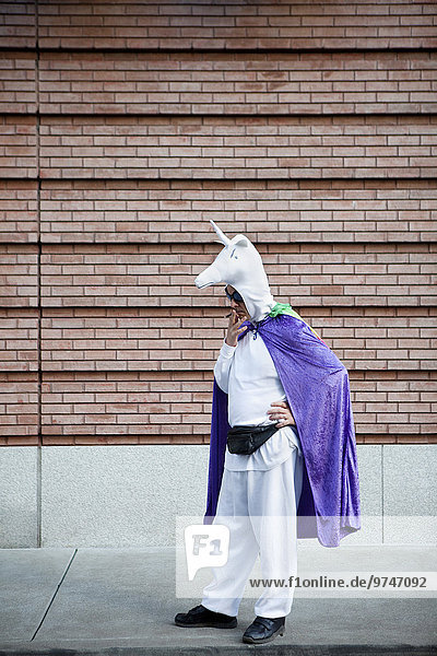 Caucasian man in unicorn costume