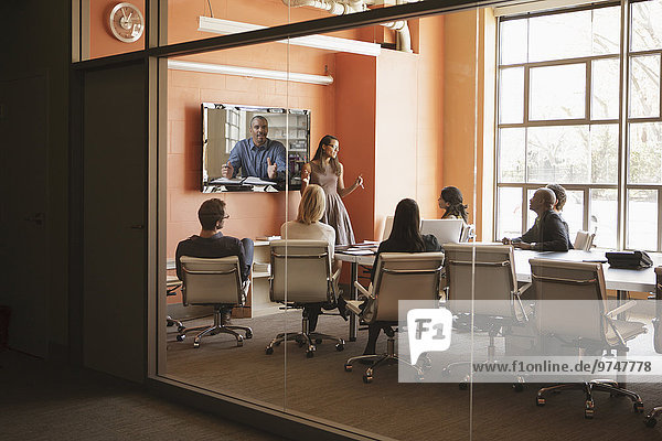Business people having teleconference in meeting