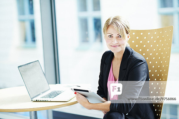 Young businesswoman sitting in office