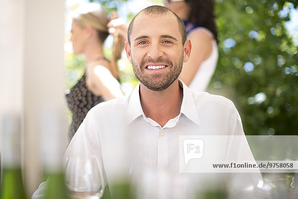 Portrait of smiling man on a wine tasting session
