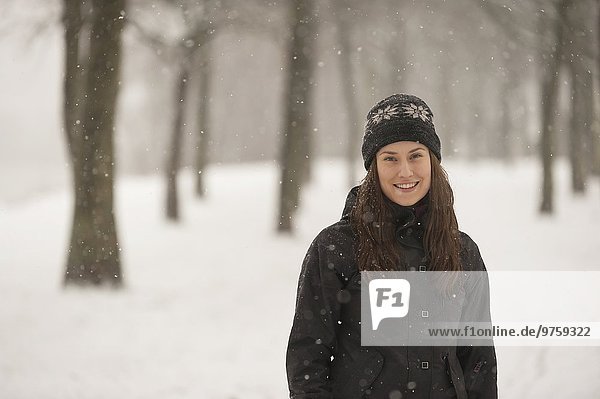 Smiling young woman in winter