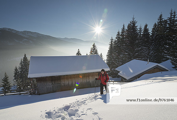 Austria  Tyrol  Schwaz  woman snowshoeing
