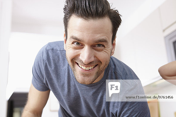 Portrait of mid adult man at home