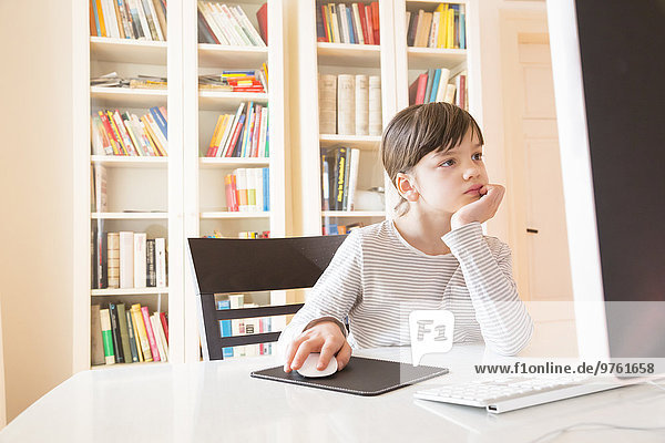 Portrait of girl spending time at computer