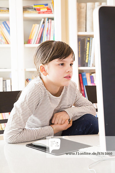Portrait of girl spending time at computer