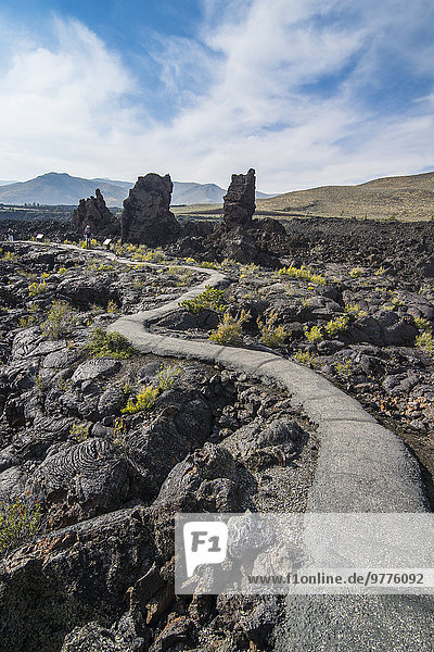 Walkway through cold lava in the Craters of the Moon National Park  Idaho  United States of America  North America