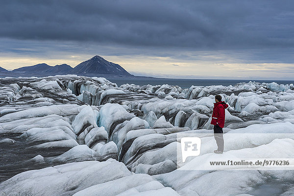 Man standing on a huge glacier in Hornsund  Svalbard  Arctic  Norway  Scandinavia  Europe