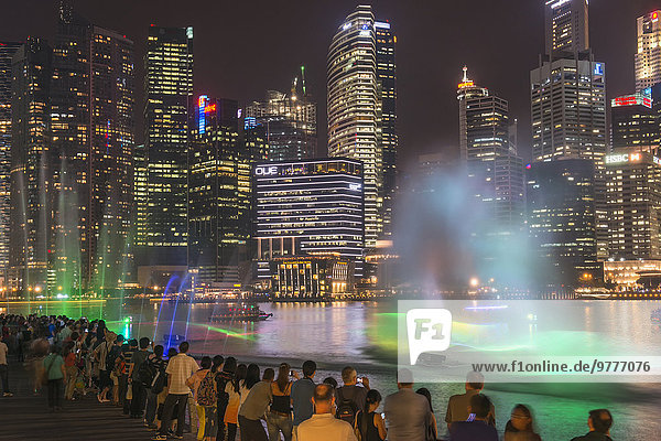 Lightshow in front of downtown central financial district at night  Singapore  Southeast Asia  Asia
