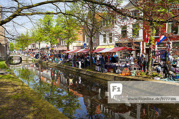 King's Day Flea Market along a canal  Delft  South Holland  Netherlands  Europe