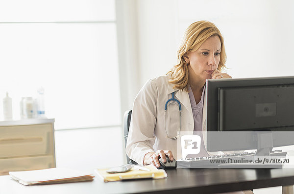 Female doctor using computer
