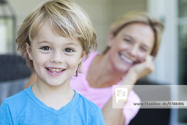 Caucasian boy smiling with mother