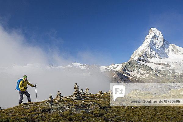 Hiker on the Höhbalmen trail  the Matterhorn at the back  Zermatt  Canton of Valais  Switzerland  Europe