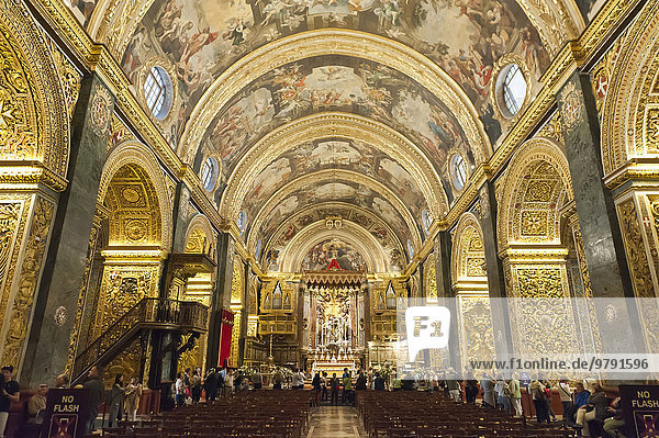 Baroque church  ornately decorated interior  golden decorations and ceiling paintings  nave  St. John's Co-Cathedral  Order of the Knights of Malta  Valletta  Malta  Europe