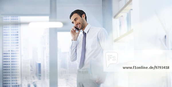 Man using smartphone in office