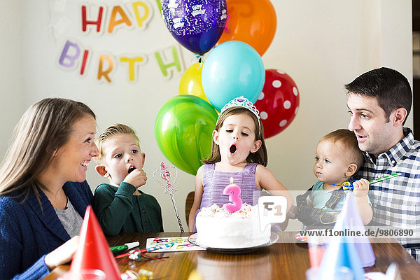 Family with three children (2-3  4-5) celebrating birthday