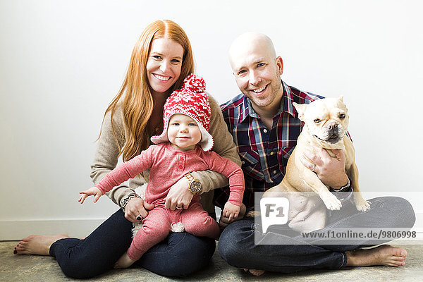 Family with baby son (2-3) and pug