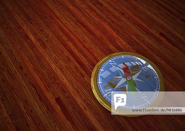 3D-Rendering  Goldener Kompass auf Holzuntergrund