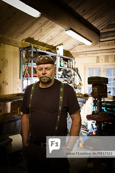 Portrait of craftsman in his workshop
