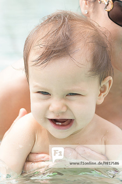Portrait of baby girl in swimming pool