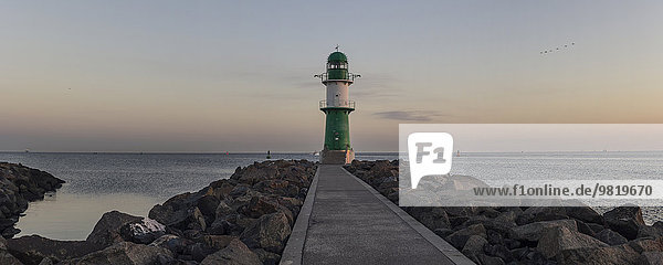 Germany  Warnemuende  lighthouse at dawn at the Baltic Sea