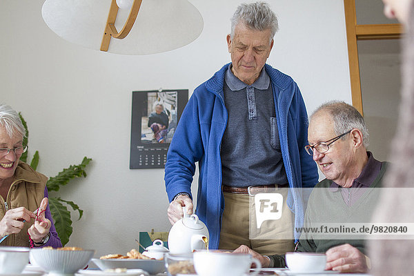 Seniors of a flat-sharing community at tea-time