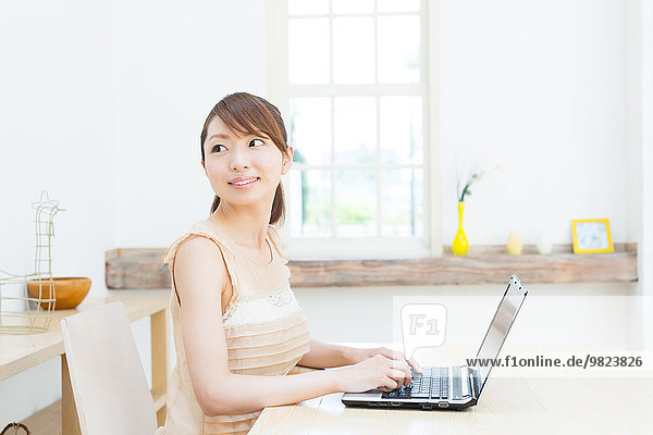 Attractive young girl working with laptop