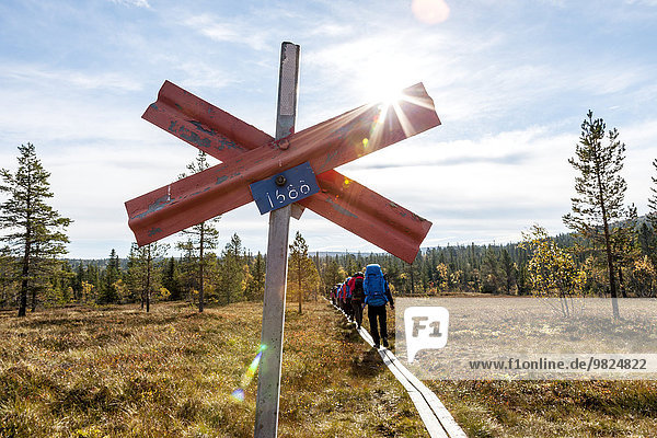 Trail marking  hikers on background
