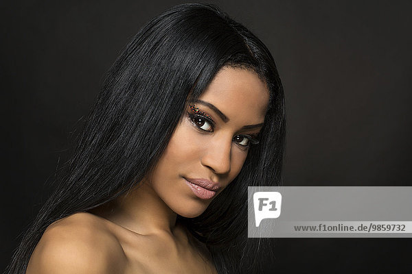 Young woman with long black hair  beauty portrait